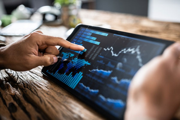 A person reviewing investment performance on a tablet