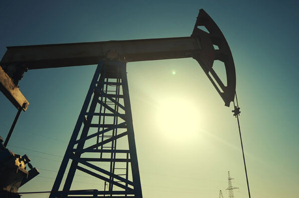 A silhouette of an oil pump